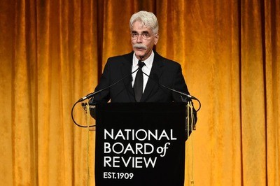 Sam Elliott standing at the podium at the National Board of Review Awards Gala in 2019. 