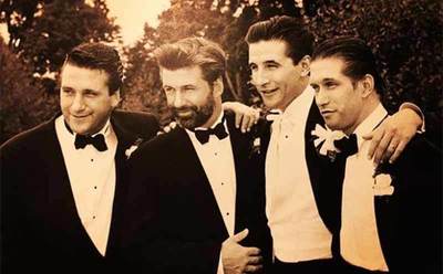 The four Baldwin brothers posing in tuxedos 