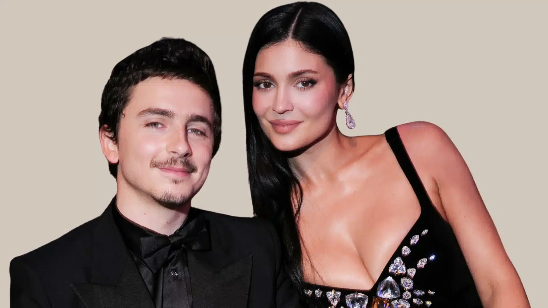 Timothée Chalamet in a black tuxedo, beside Kylie Jenner in a sparkling black dress, against a neutral background
