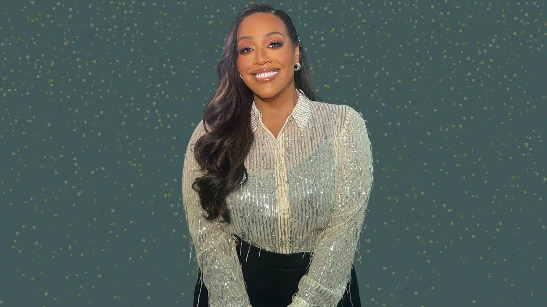 Alison Hammond's weight loss image, she is in a silver sequined shirt against a dark green background